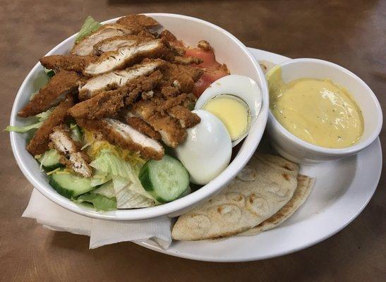 Chicken strip salad with honey mustard dressing.