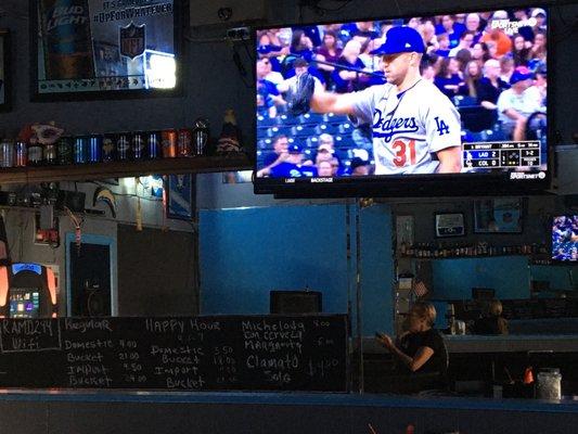 Dodgers game, happy hour menu, and bartop.