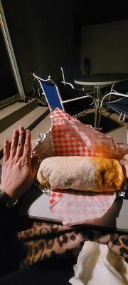 My giant hand is in there for reference... I'm 5'10" tall and this burrito makes it look small.