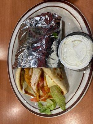 Chicken Fingers Pita w Ranch dressing. It's good, our waitress was right. Warm soft pita with salad and chicken fingers.