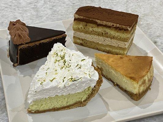 Clockwise from top left: Chocolate Cake, Tiramisu, Cheesecake, Key Lime Pie