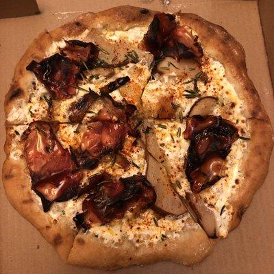 The Harrison (prosciutto, pear, Gorgonzola and fried rosemary) with a gluten free crust.