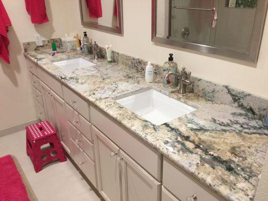 New beautiful countertop, new mirrors and custom cabinets.