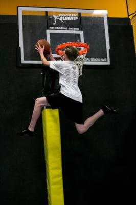 Realize your dunking dreams by going for air from a trampoline in our basketball arena.