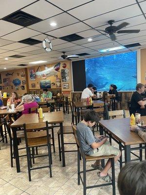 Restaurant with the huge aquarium screen