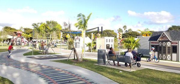 The park where many children like to ride their bike and play, this is a different area than the dog park area which is fenced in.