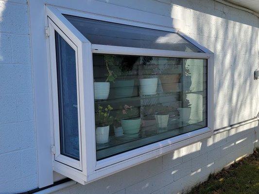 This is the after picture of 2 double hung mulled windows which was replaced with a garden window.