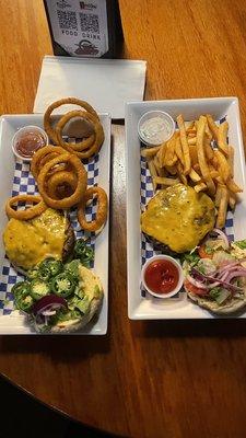 Regular Cheese Burger with fries and Tex Mex Burger with onion rings