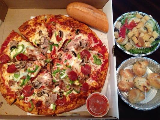 Deep-dish special combo, garden salad, and garlic knots!