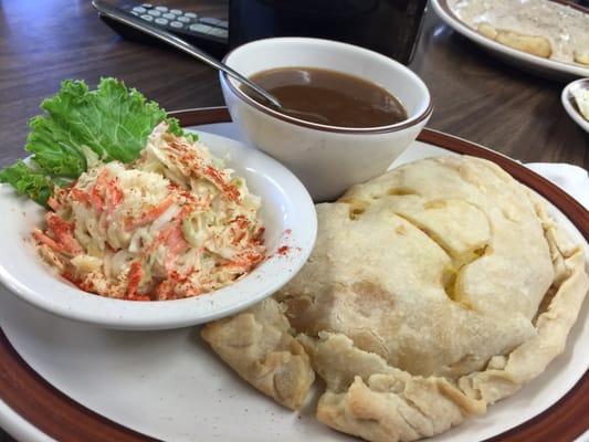 Breakfast pastor with gravy and coleslaw.