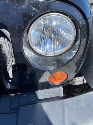 Still see the dirt around the headlight.