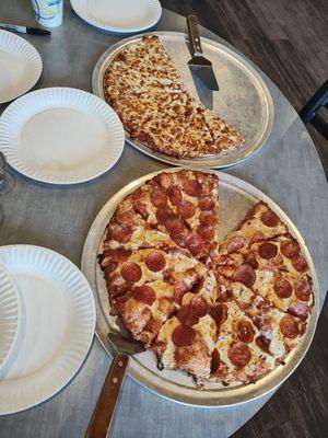 Large one-topping cheese and pepperoni pizzas for a softball team