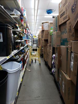 You can't see ANY of the items being displayed on the shelves behind the stacked boxes.