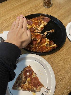 Montague's Meat Marvel Medium Pizza compared to hand