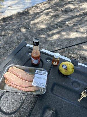 Pre packaged smoked brisket, organic pear, and my tailgate