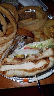 Chicken cutlet club with onions, tomatoes and lettuce