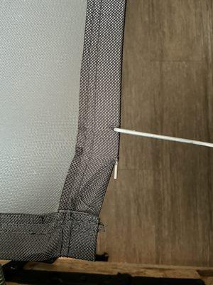 Metal frame torn through fabric and not properly built