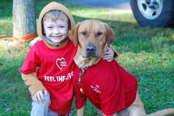 a sweet moment captured with our shop dog "Beau" at our 2022 Feel the Love eventy