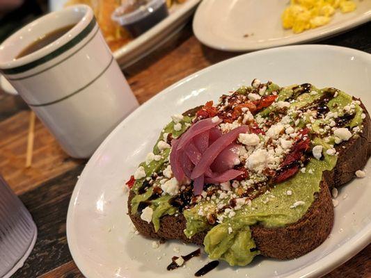 Avocado toast with feta and pickled onion