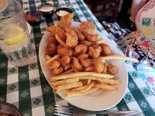 All-you-can-eat fish+popcorn shrimp. Comes with hushpuppies, slaw, tartar sauce and honey mustard.