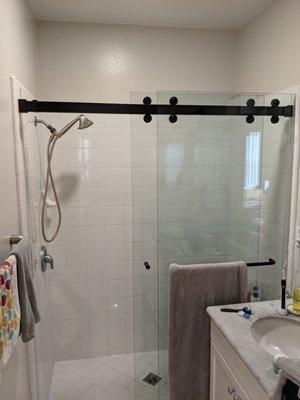 Frameless Sliding Shower Door with Matte Black Hardware