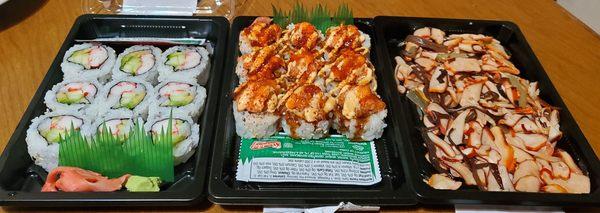 My dinner (left to right: California Rolls, spicy tuna & shrimp volcanoes rolls & squid salad)