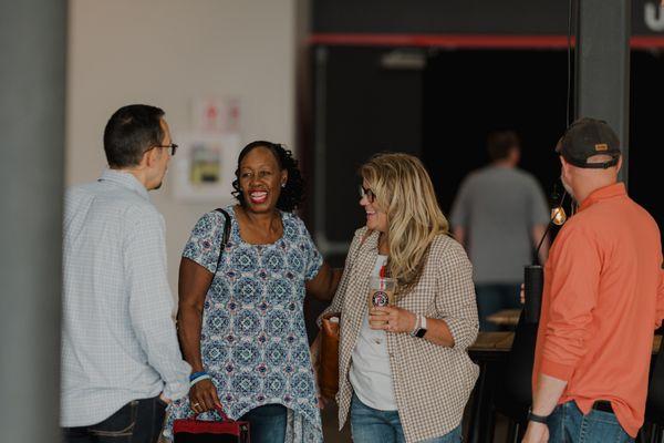 Congregation members interacting in the lobby