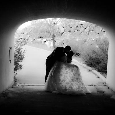 Bride and groom in tunnel