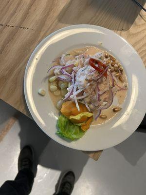 Ceviche de pescado ( Fish ceviche marinated in lemon juice, salt and pepper, and Peruvian chili peppers )