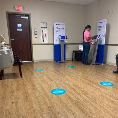 Waiting area with check in kiosks