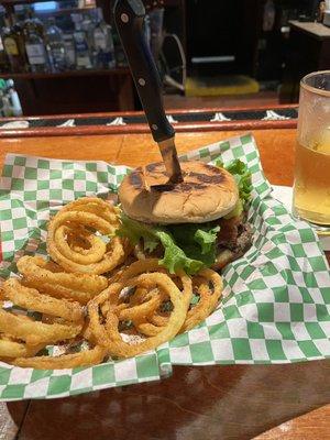 Bacon cheeseburger with onion rings.