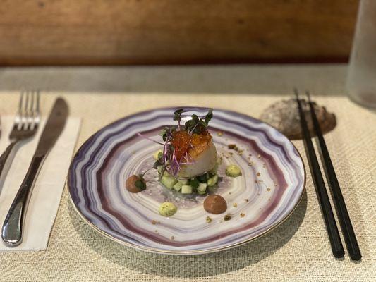 Curried scallop with apple salad and avocado purée and salmon roe and micro greens.