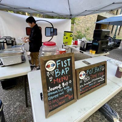 Overall space, menu and the owner making a meal