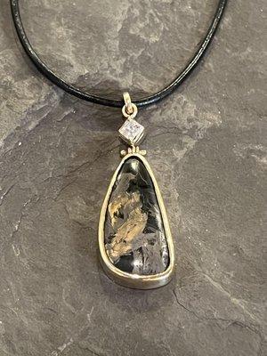 18K Black Jade bezel set in 14K yellow gold dramatically hinged from a pricess cut diamond on a waxed black leather choker necklace