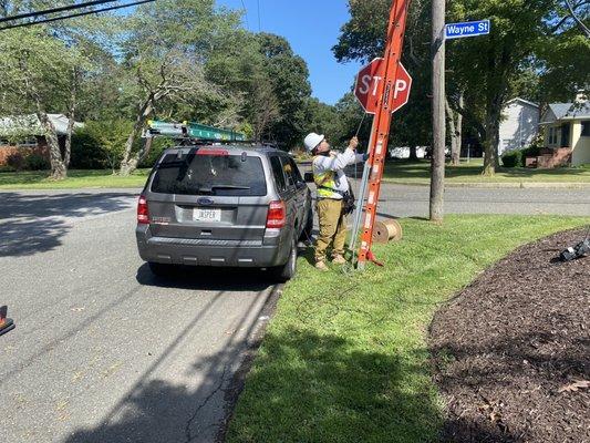 Optimum technician putting the ladder where it should have been in the first place