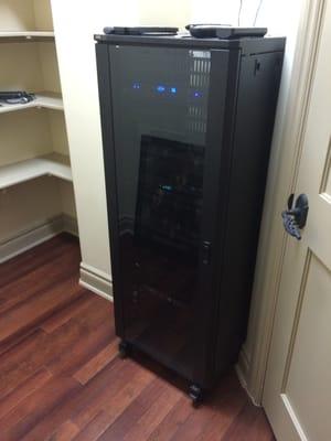 Home theater equipment rack setup in utility room