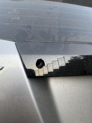 Bullet whole damage to the black plastic insert