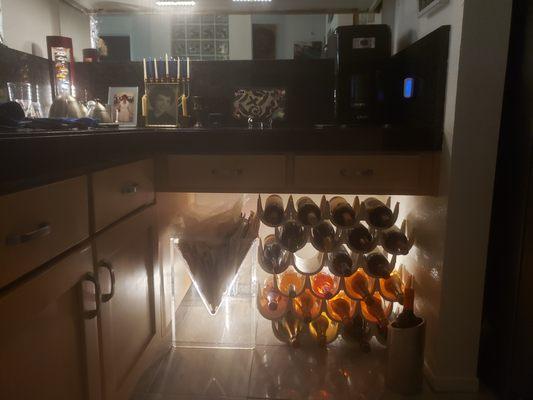 New mirror below my liquor cabinet and new lights behind my wine rack below.  Beautiful!