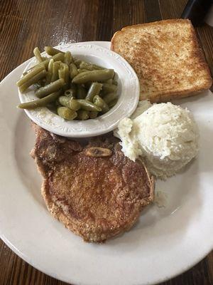 Fried porkchop, mashed potatoes, greenbeans, and Texas toast (onion brown gravy was on the side)