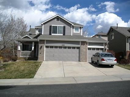 The combination of dark shutters against white trim and grey siding brought this house back to life