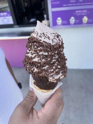 Chocolate with chocolate sprinkles on a waffle chocolate cone.