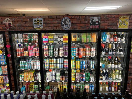 Support local brewers, cold beers in cooler at Fenwick Liquor