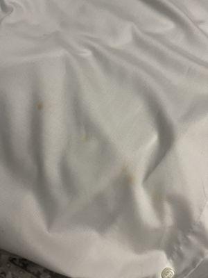 Stains caused by dry cleaner.