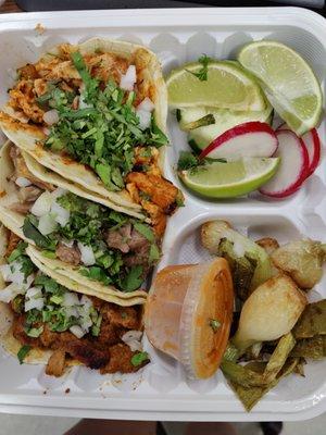 From top to bottom: pollo loco, carnitas, and al pastor tacos