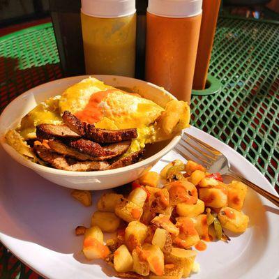 Chilaquiles Verdes breakfast plate, I added red house salsa for the photo. Outdoor table.