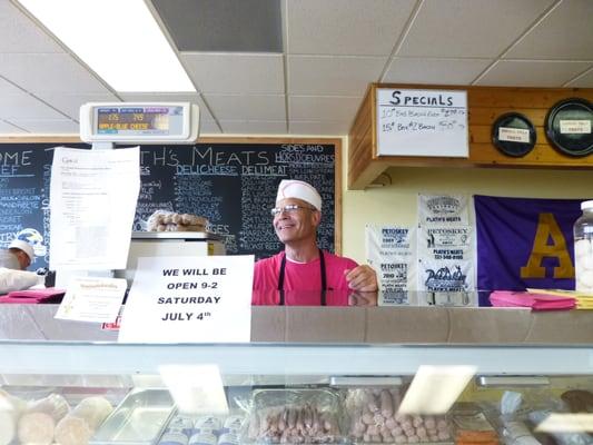 The nice man who cured my hot dog jones.   Look at those yummie hot dogs in the case!