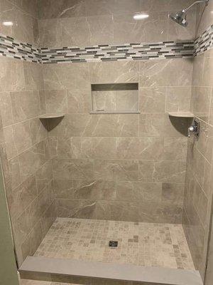 Recent bathroom remodel project including tile, recessed lighting and shower design.