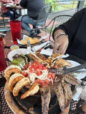 Molcajete, chicken , beef , shrimp , chorizo beans and lots of cheese