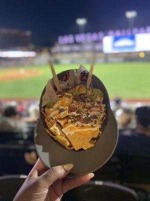 Carne Asada nachos in a souvenir cap