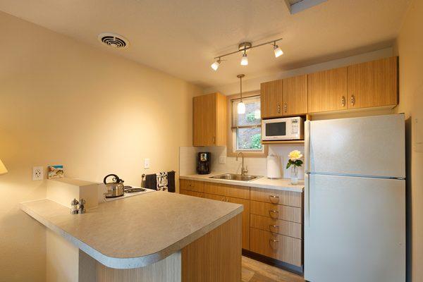 Full kitchen for convenient in-room dining.